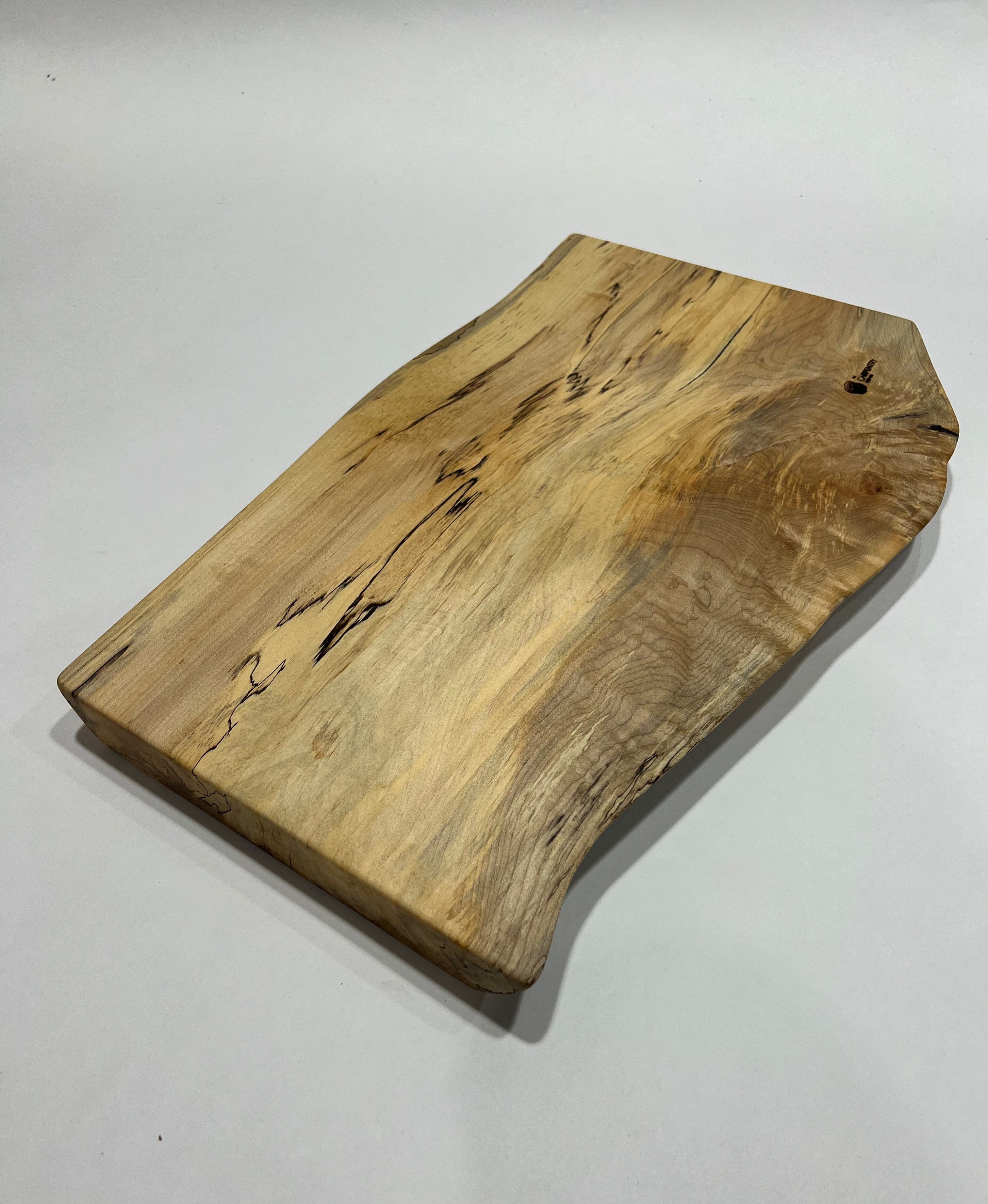 http://www.thecarpentryshopco.com/cdn/shop/products/cutting-boards-charcuterie-platters-spalted-maple-and-black-epoxy-slab-charcuterie-board-001-38989669859554.heic?v=1676489689
